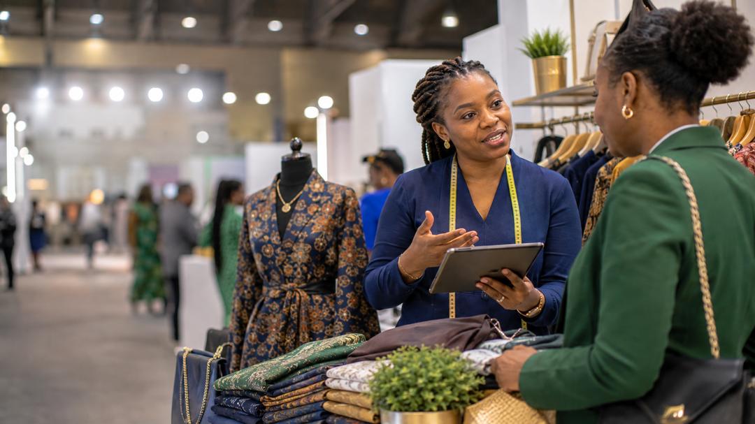 Nigerian entrepreneurs and visitors at an SME exhibition